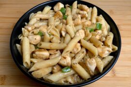 Quick Easy Chicken Penne in a little black bowl