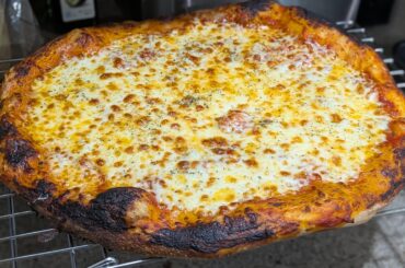 Let the pizza cook a little more than normal, turns out I've been undercooking my cheese slightly!