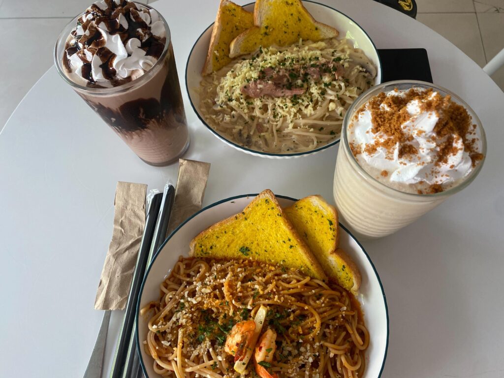 Pasta Cafe Date — Shrimp Spaghetti, Creamy White Sauce Pasta, Garlic Bread, and Iced Coffee