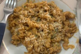 Fusilli with rose sauce, cheese, bacon, and herbs.