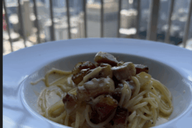 spaghetti carbonara with large guanciale chunks,