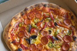 I'm very much an amateur but trying to get better everytime I make a pie. Pecorino, Mozzarella, Roasted Peppers, Pepperoni, Ham, Mushrooms, Jalapeños.