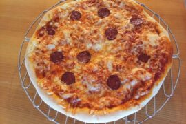 Pizza with sausage and white onion