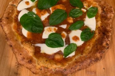Outdoor fire oven for crust/sauce, then regular oven for toppings (550)