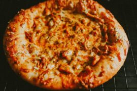 Leftover butter chicken pizza! Naan dough.