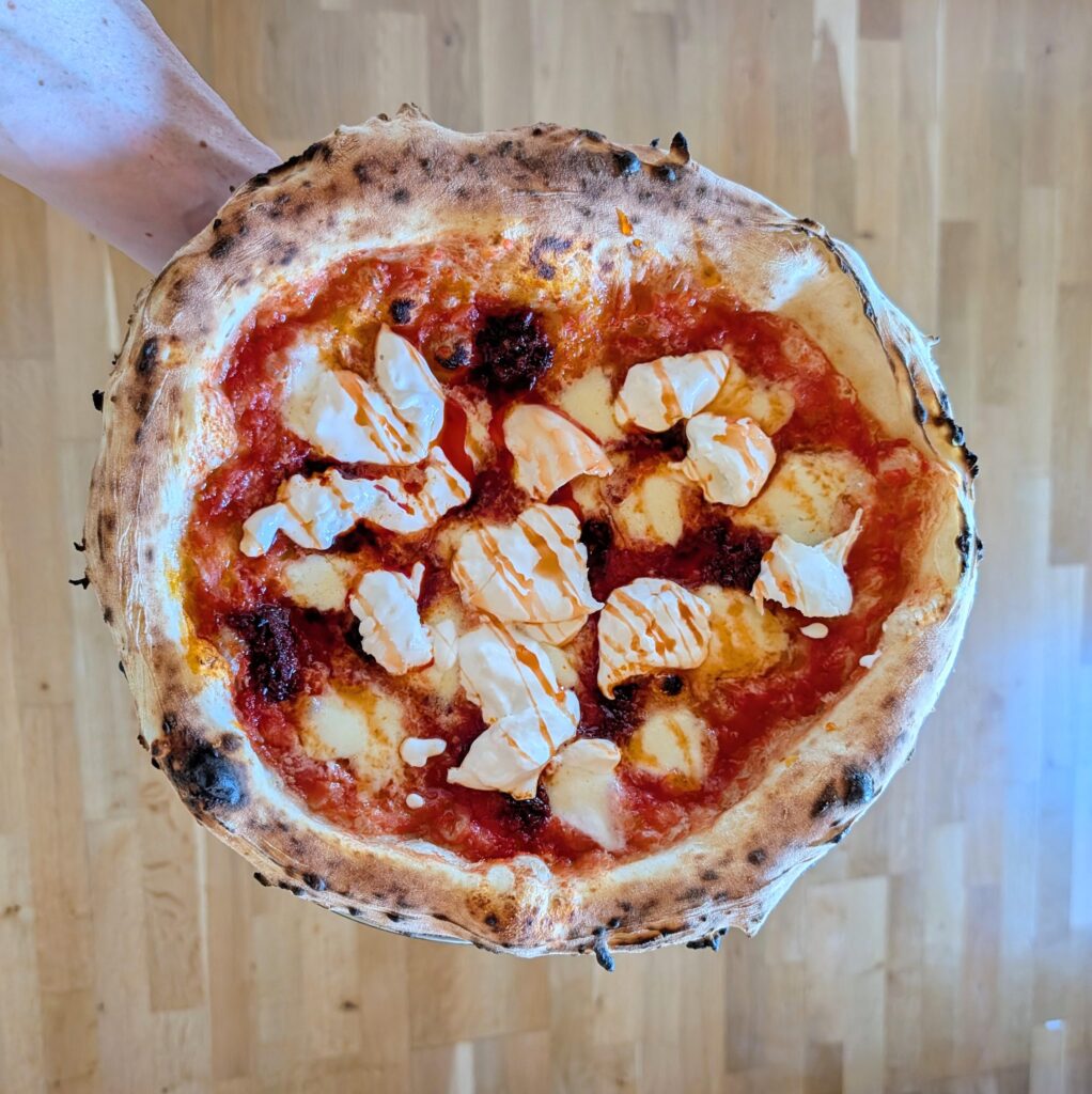 San marzano, mozzarella and n'duja. Burrata and chili honey post bake.
