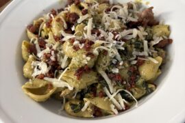 Pesto cream with shells, lacinato kale, and sausage crispies