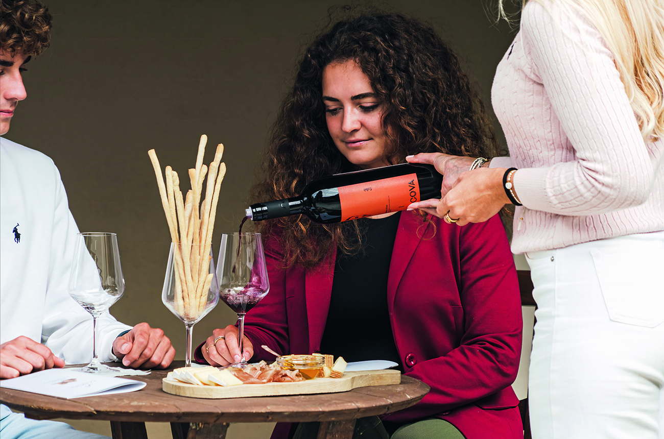 Two people tasting wine