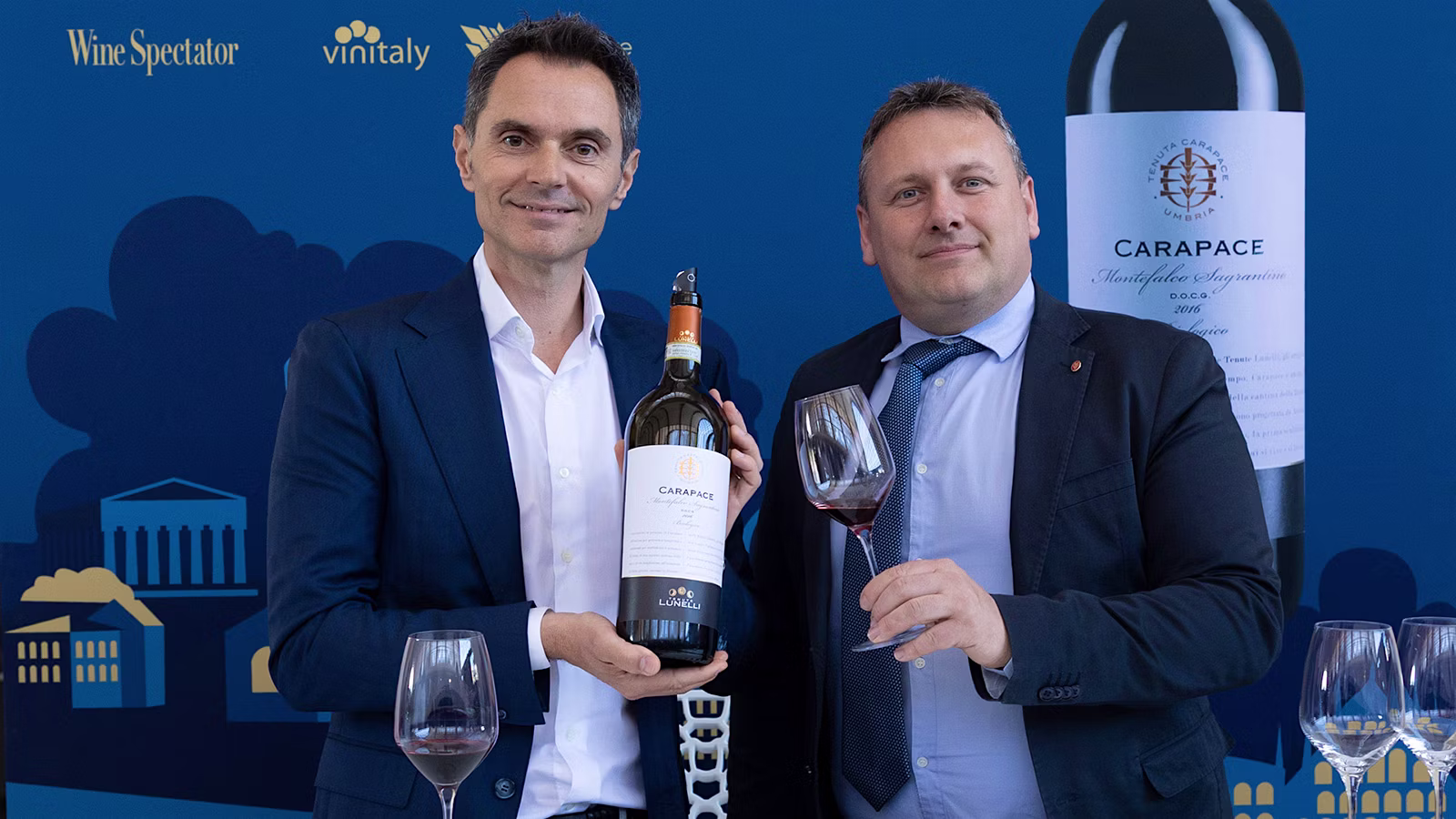  Alessandro Lunelli, left, and Luca Capaldini at OperaWine 2026 in Verona.] 