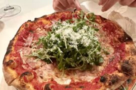 Homemade prosciutto and tossed arugula