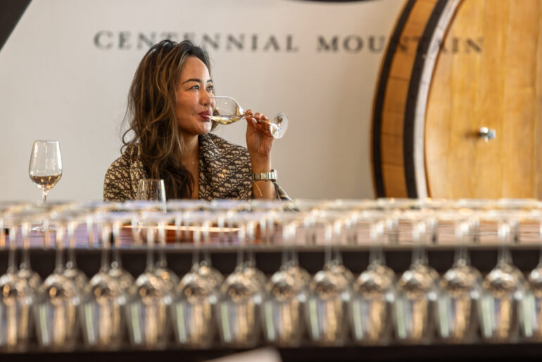 Denise Bee tastes a Carricante Italian white wine varietal at Centennial Mountain