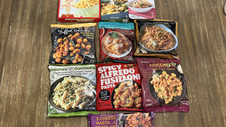 10 Trader Joe's Frozen Pasta Meals in Packages on Wooden Table