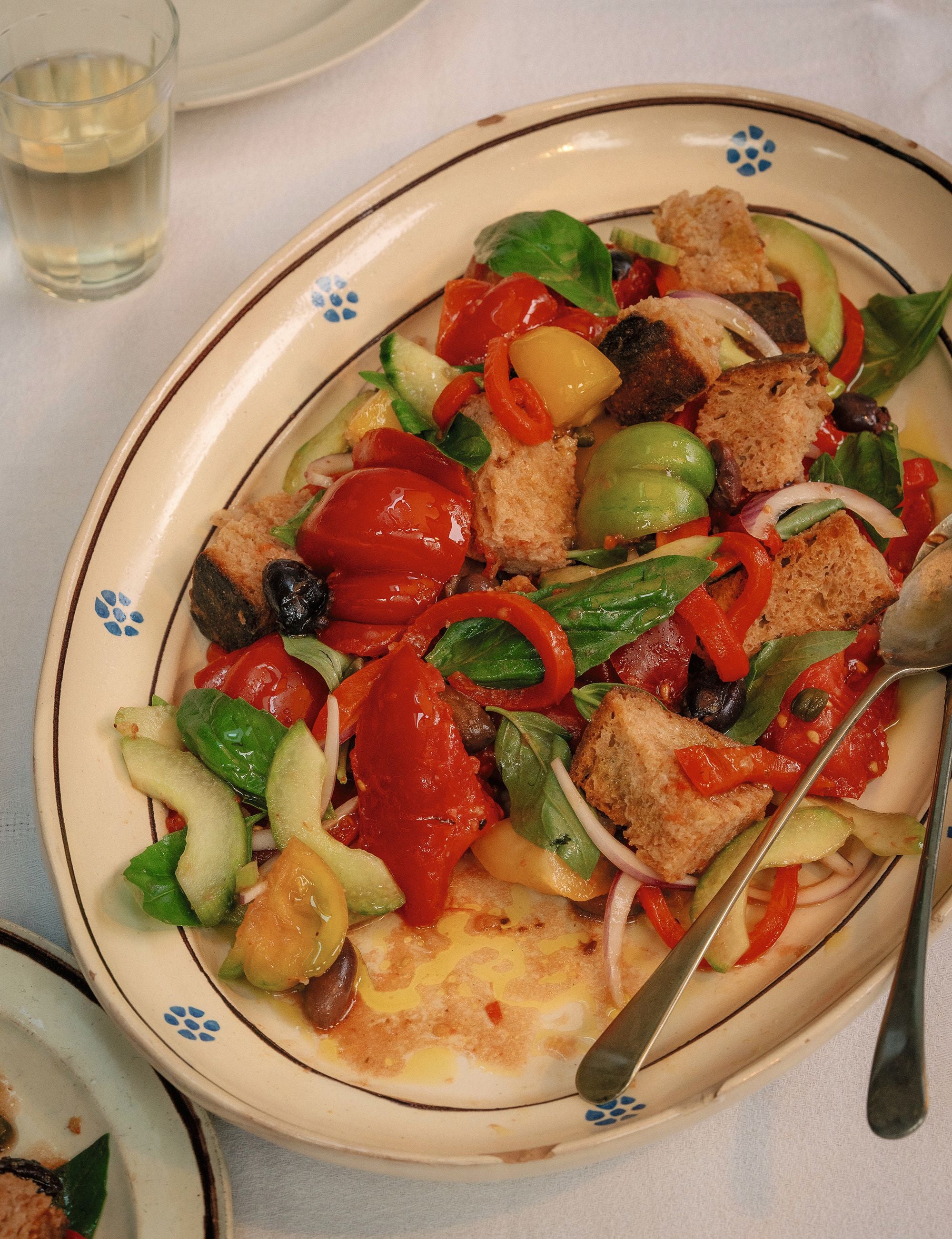 Tiella’s panzanella combines ripe tomatoes, stale bread, peppers, olives and basil in a classic Tuscan salad