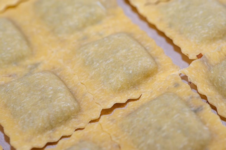 Fresh ravioli comes off a machine at Sorrentino Pasta's wholesale location in Ambler.