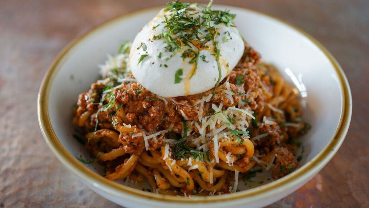 Spaghetti Bolognese + Burrata from Fire & The Feast, an Italian Restaurant located in Edmonds, WA. Spaghetti Bolognese + Burrata from Fire & The Feast, an Italian Restaurant located in Edmonds, WA.