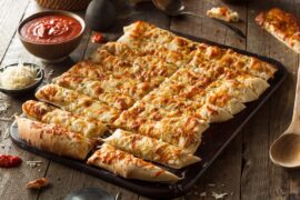 7 Pizza Chains With the Best Cheesy Bread, According to Fans