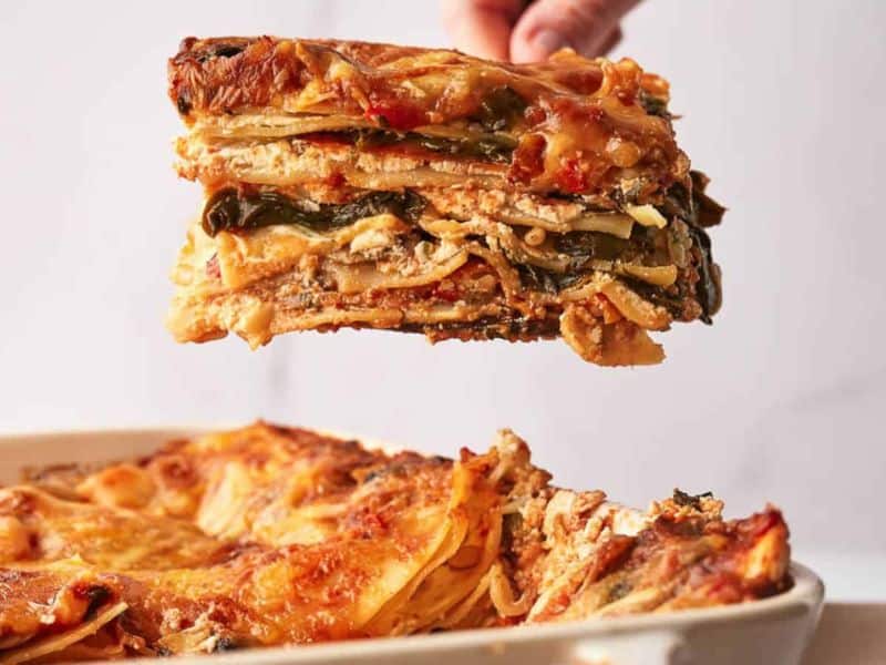 A lasagna being dished up.