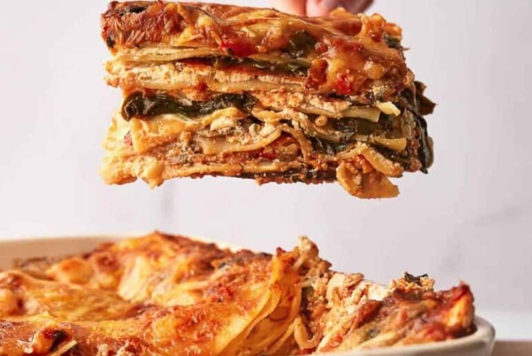 A lasagna being dished up.