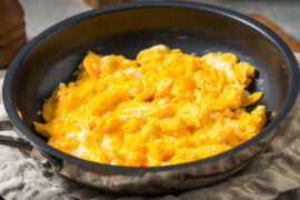 Spice Up Basic Scrambled Eggs With One Jarred Ingredient That's Rich In Italian Flavor