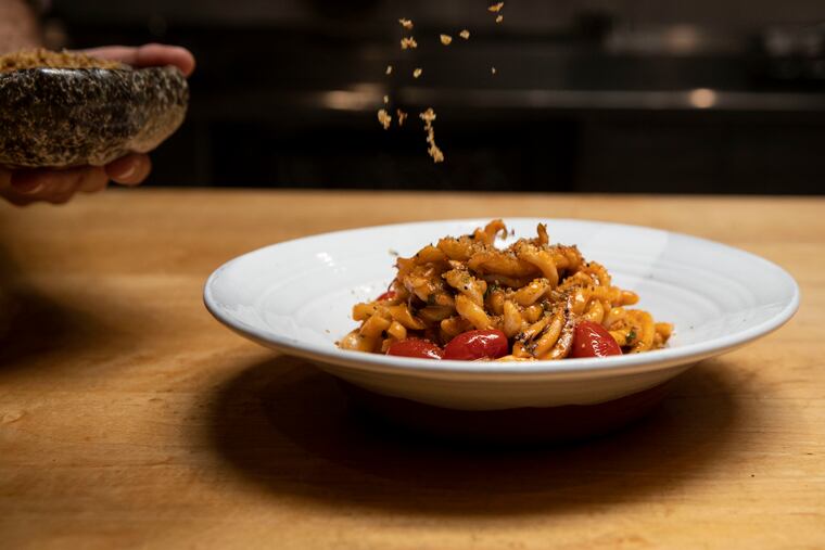 Fusilli lunghi with squid, cherry tomatoes, and mint at Andiario in West Chester, Pa. on Wednesday, August 11, 2021.
