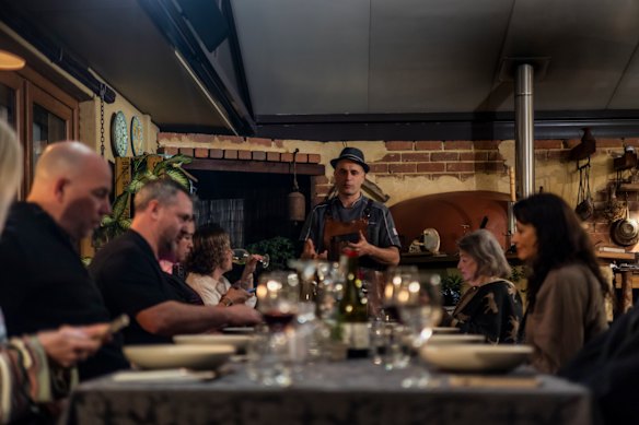 Valerio Fantinelli shares his thoughts on a dish with guests.